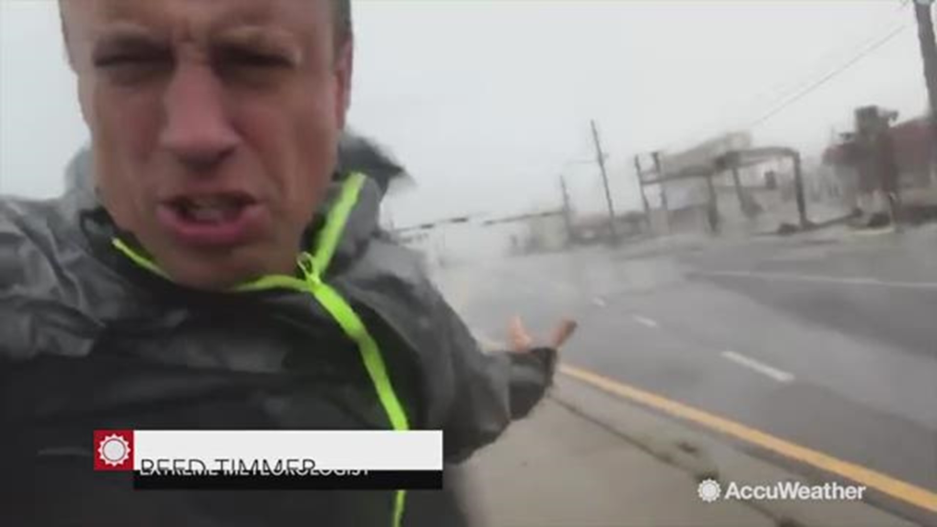 Storm chaser Reed Timmer takes cover after Michael's ferocious winds