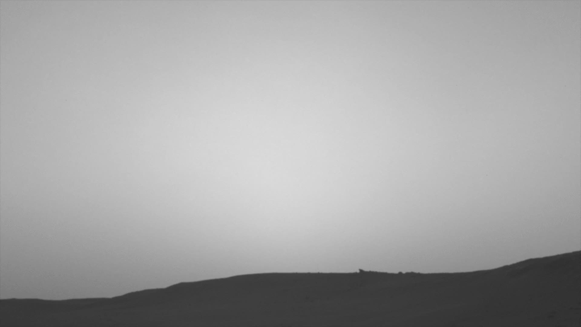 This series of images shows the shadow of Phobos as it sweeps over NASA's Curiosity Mars rover and darkens the sunlight on Monday, March 25, 2019.