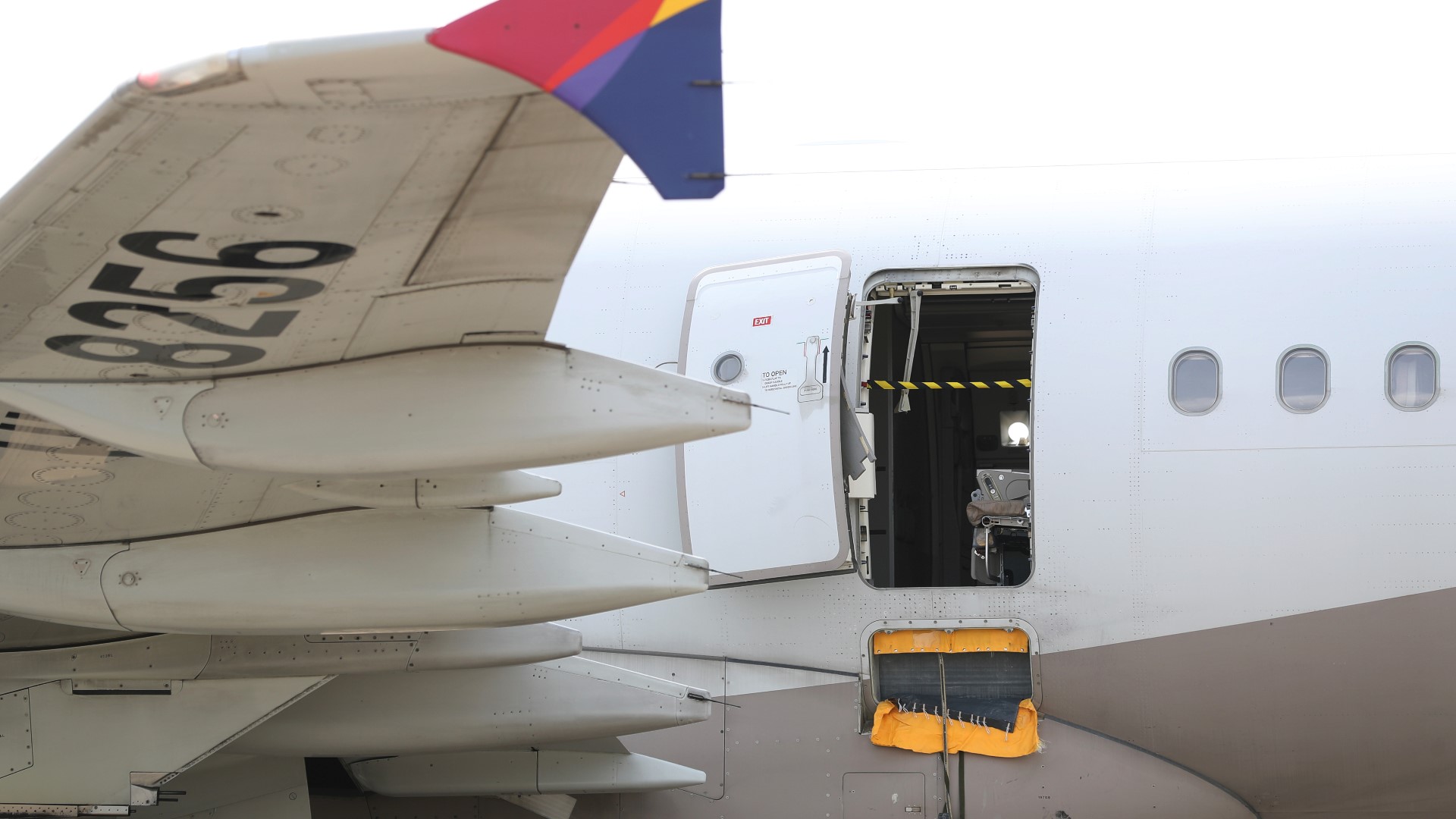 Asiana Airlines and government officials say a passenger opened an emergency exit door during a flight in South Korea.