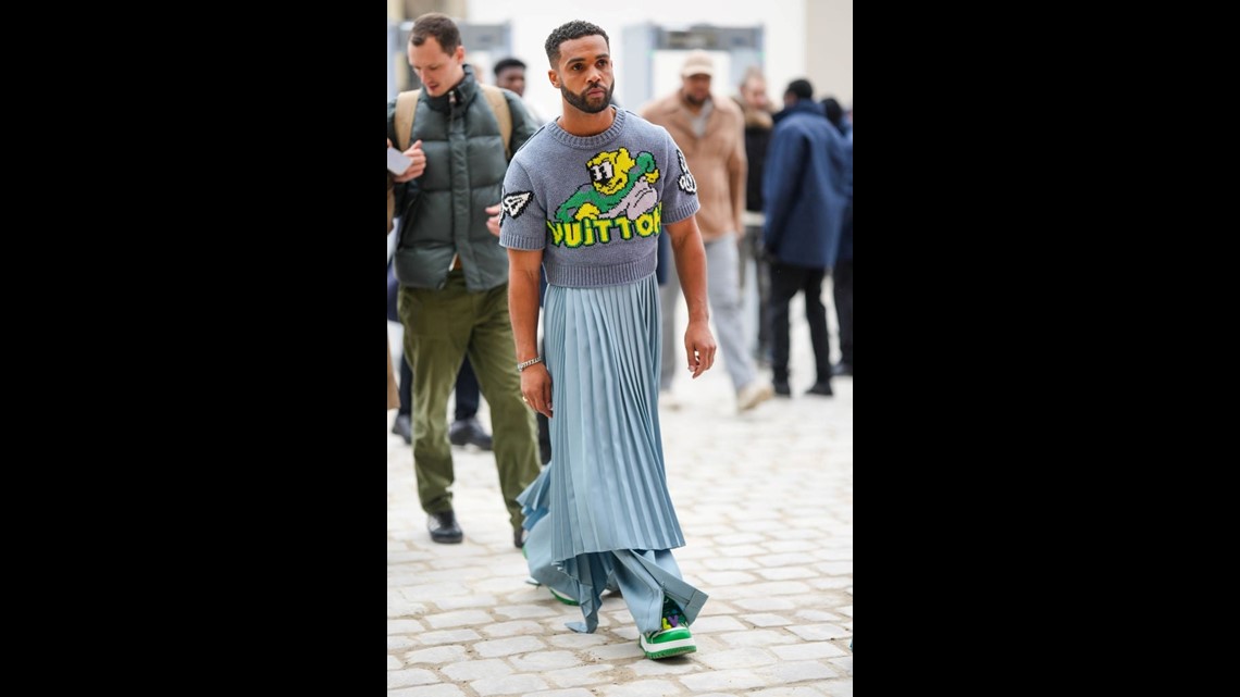 Lucien Laviscount makes quite the entrance in a blue pleated skirt during  Paris Fashion Week