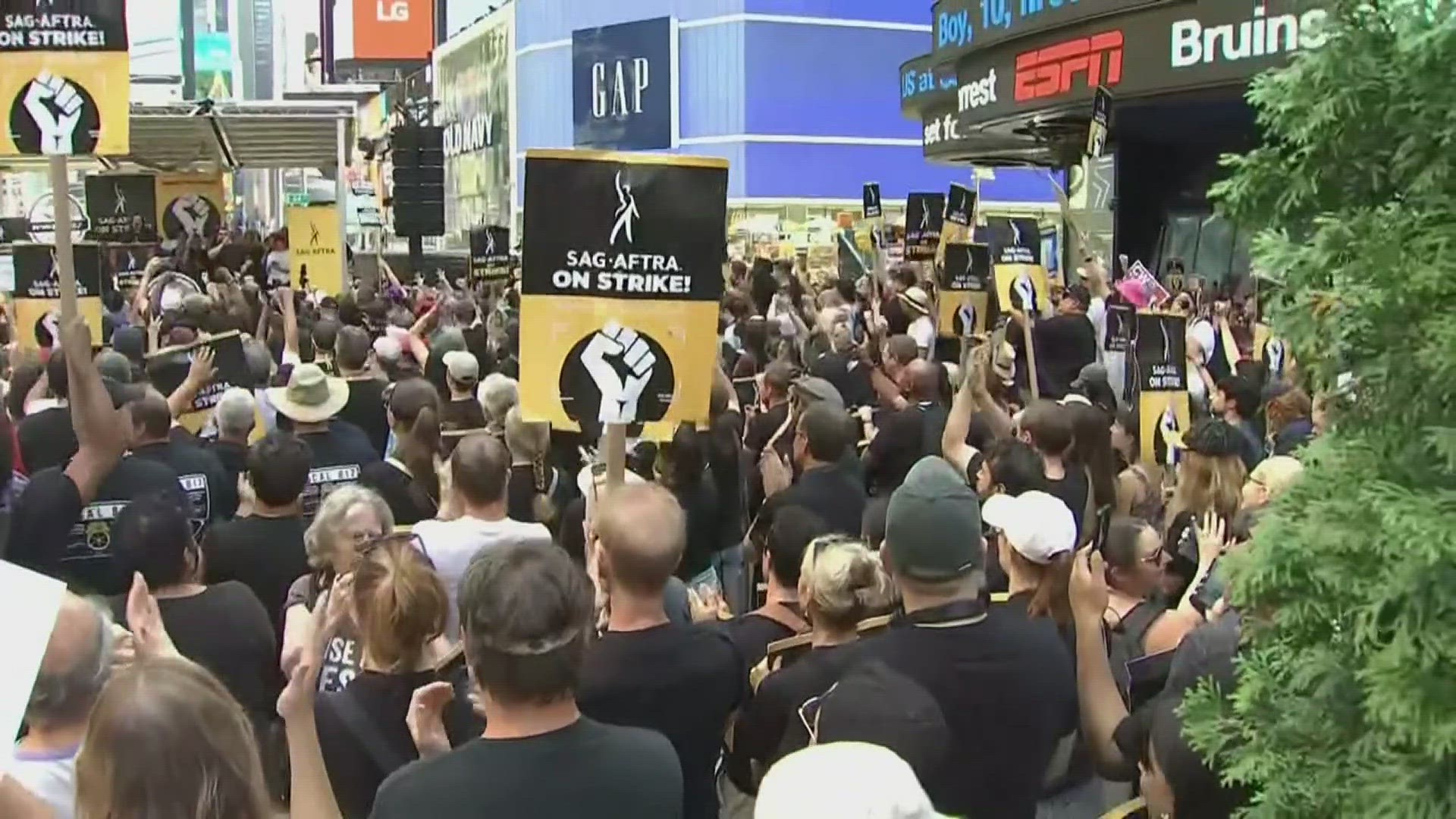 Actors and representatives from the actors union took turns giving fiery speeches on a stage in the heart of Times Square.