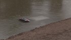 Woman survives on pocket of air after her car is submerged in a canal