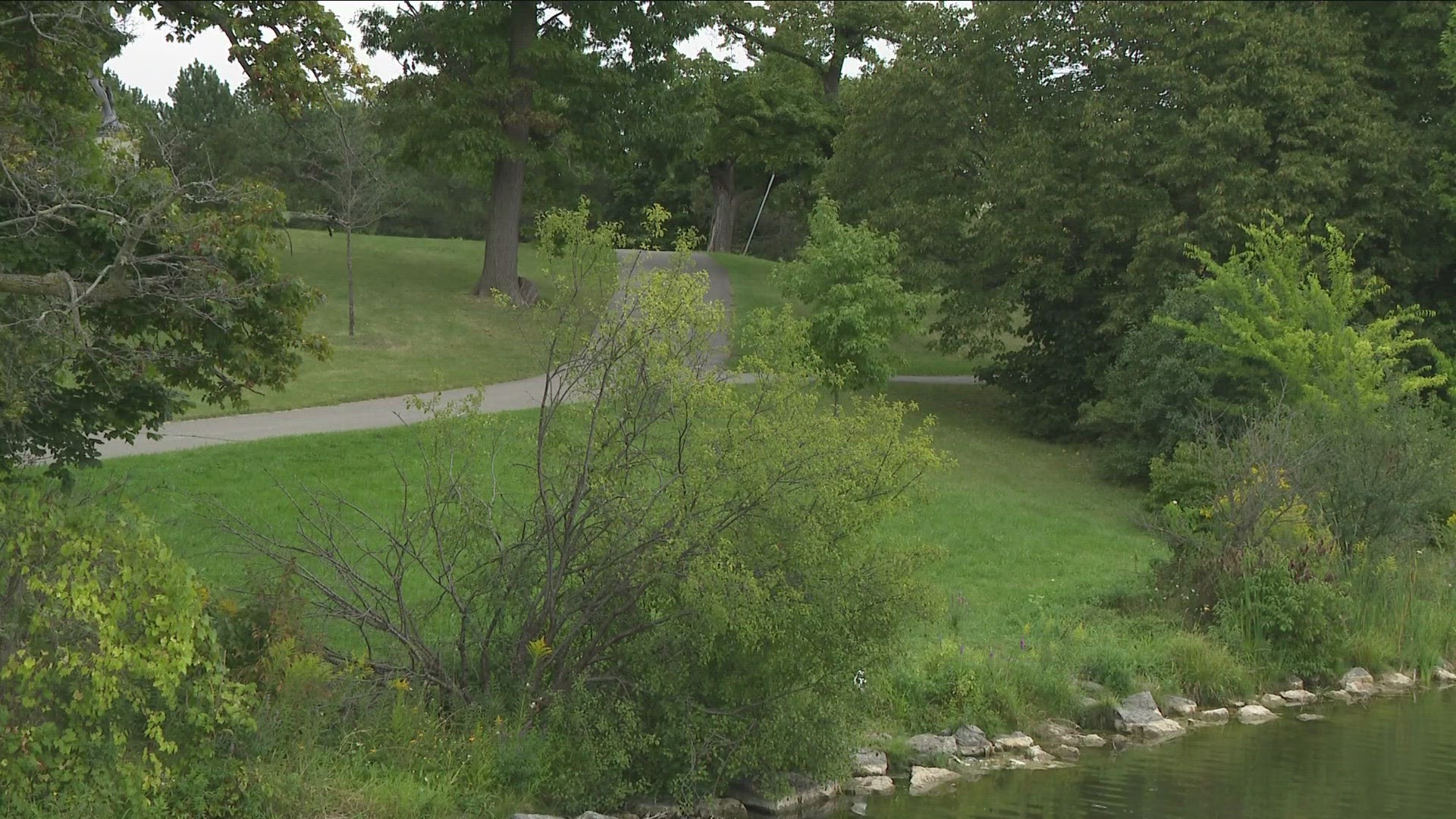 Police said a woman was walking along a path next to Hoyt Lake, near the Statue of David, when a man grabbed her at the back of her neck.