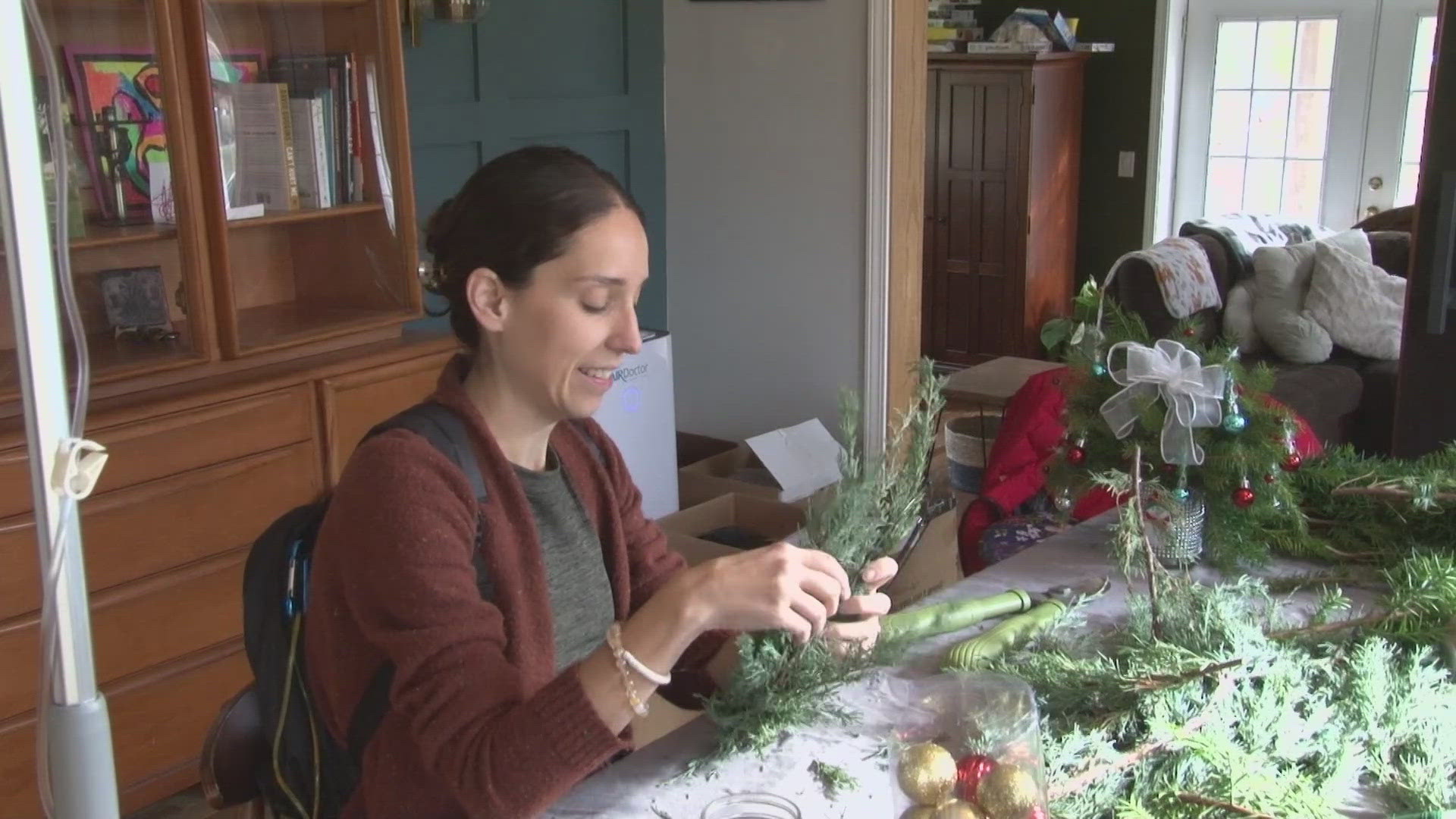 She sells the wreaths in a stand that sits at the end of her driveway. It doesn't just bring in income for Jenn, but also serves as therapy for her