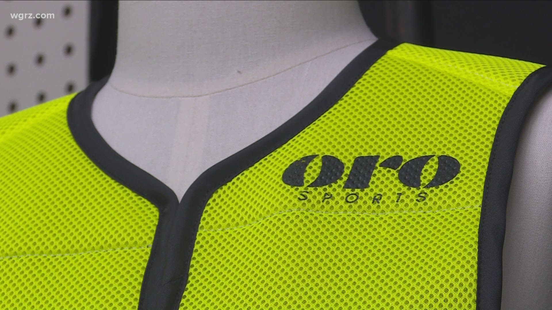 Olympians wearing vests made in Buffalo at Oro Sports company