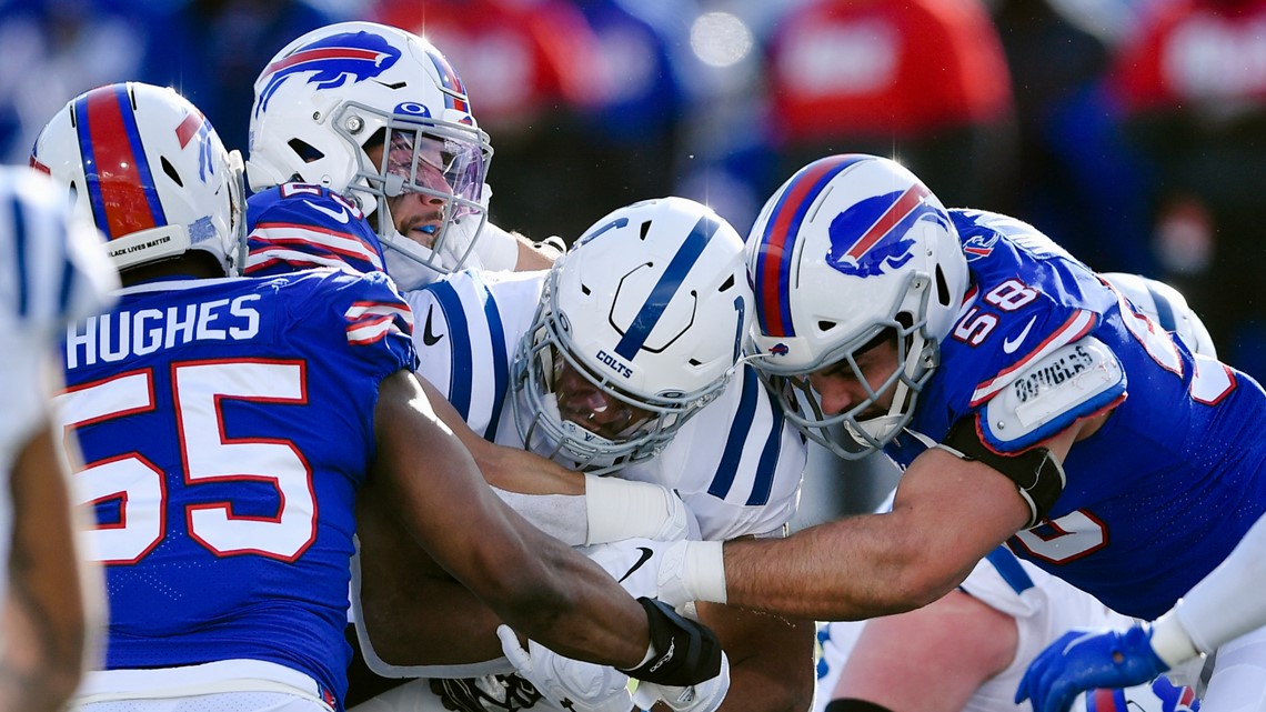 Bills fight off Colts rally for first playoff win since 1995