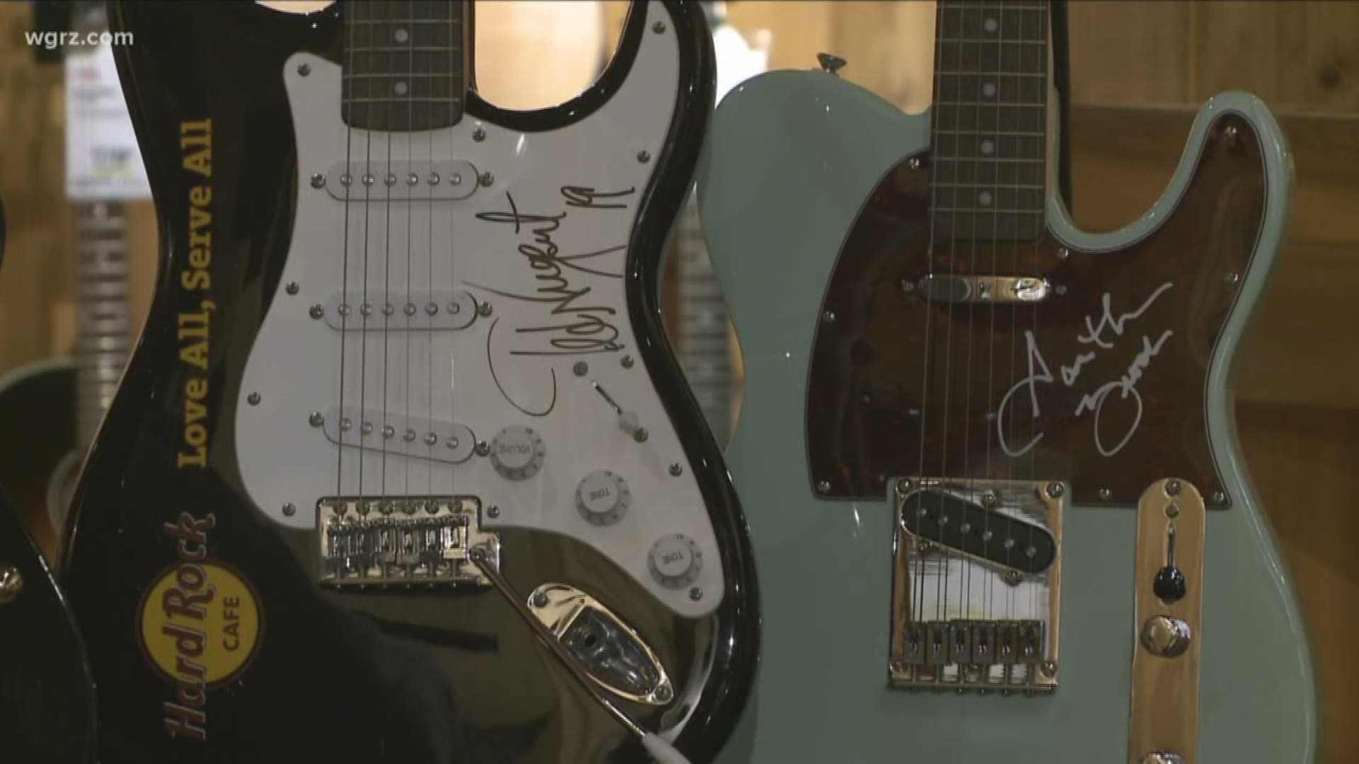 THE GUITARS ARE SIGNED BY MUSIC LEGENDS LIKE SLASH, OZZY OSBOURNE, GARTH BROOKS, AND QUEEN.