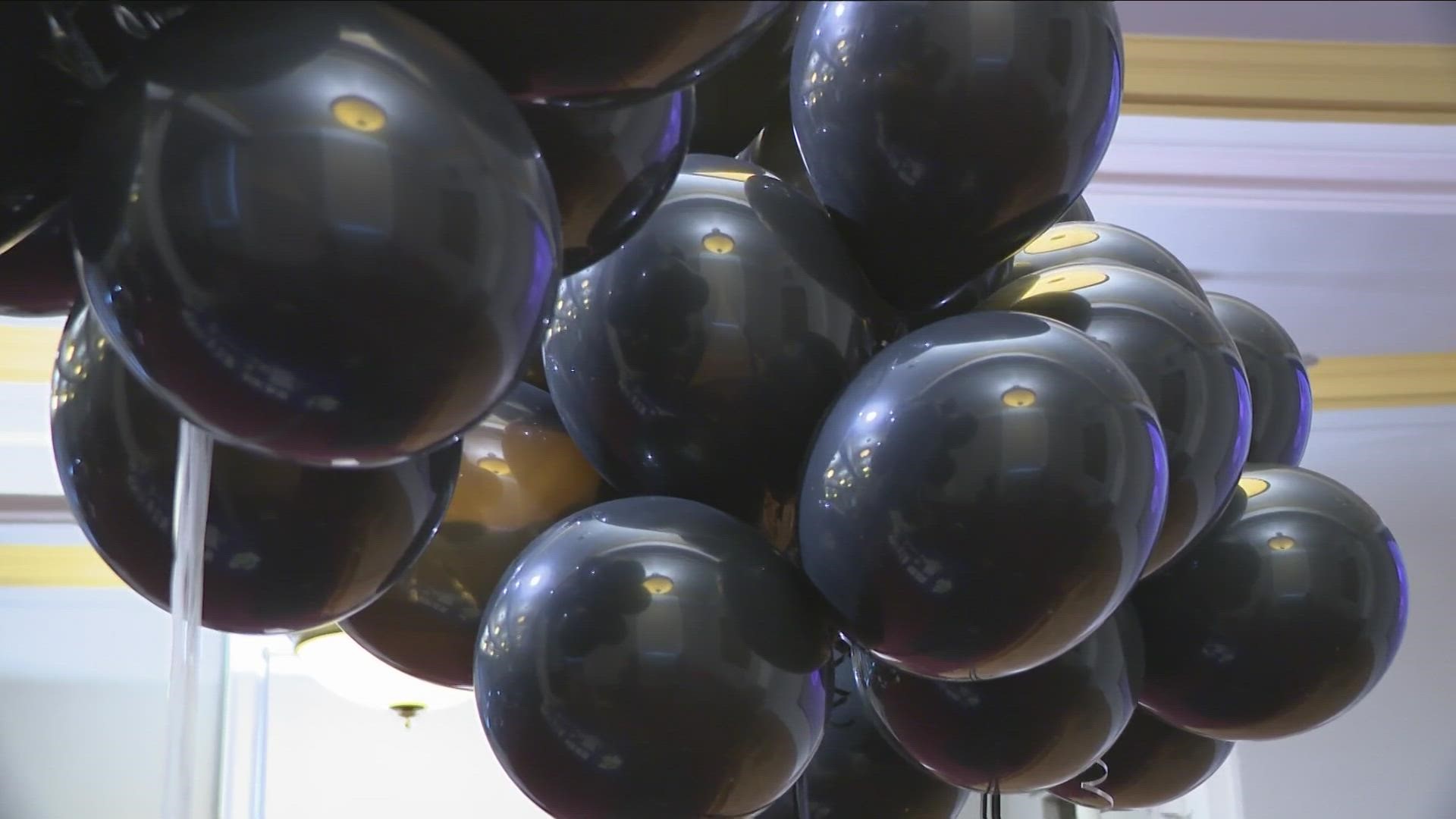 Local leaders joined family and friends to display black balloons at the Buffalo History Museum, representing their lost loved ones, by sharing photos and names.
