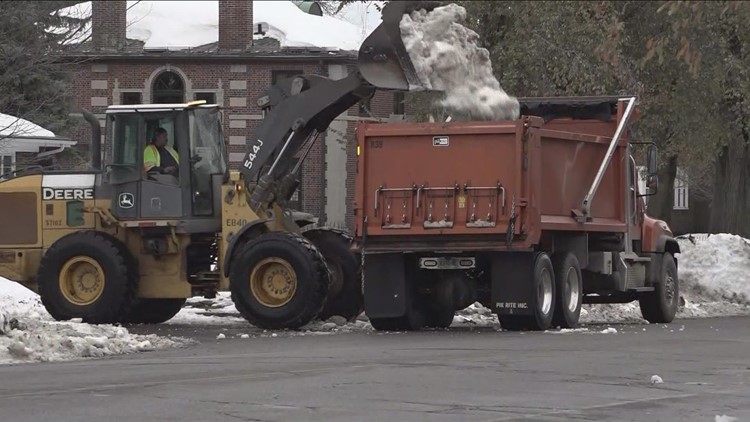 City crews moving snow in anticipation of rain and meltdown