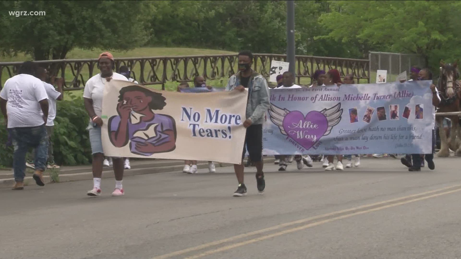 Buffalo neighbors came together to show support for a family impact by domestic violence.