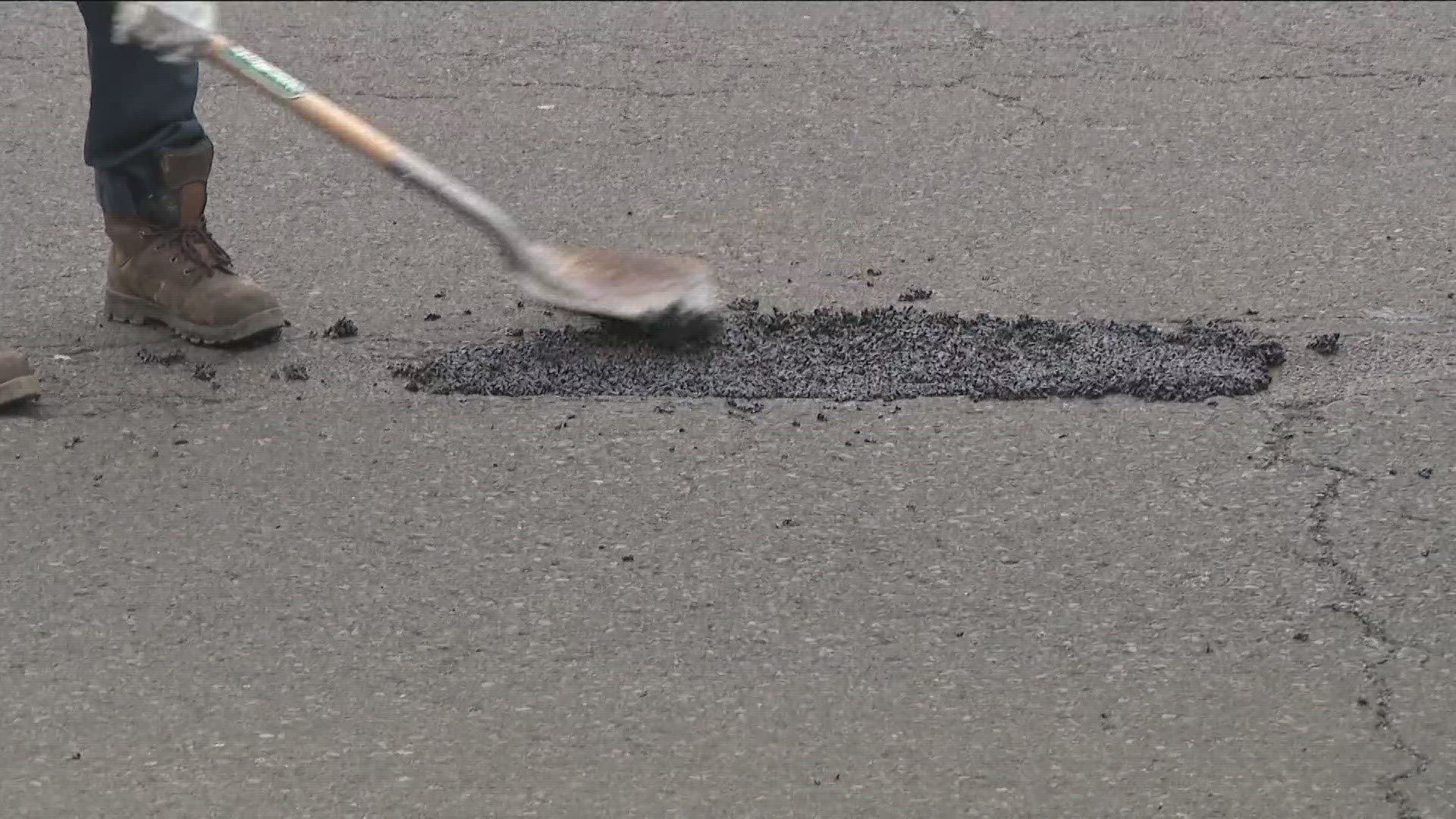 Five Department of Public Works crews moved around the city Sunday, patching rough spots on major thoroughfares.