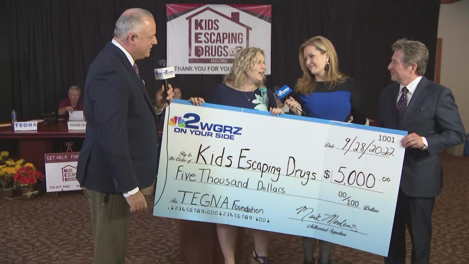 WGRZ General Manager Mark Manders presents Kids Escaping Drugs with a $5,000 check.