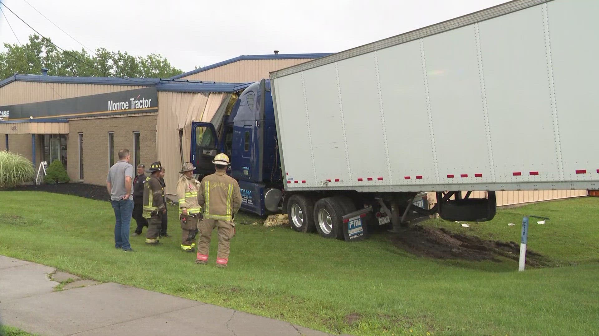 Semi truck crashes into building on Genesee street near the airport