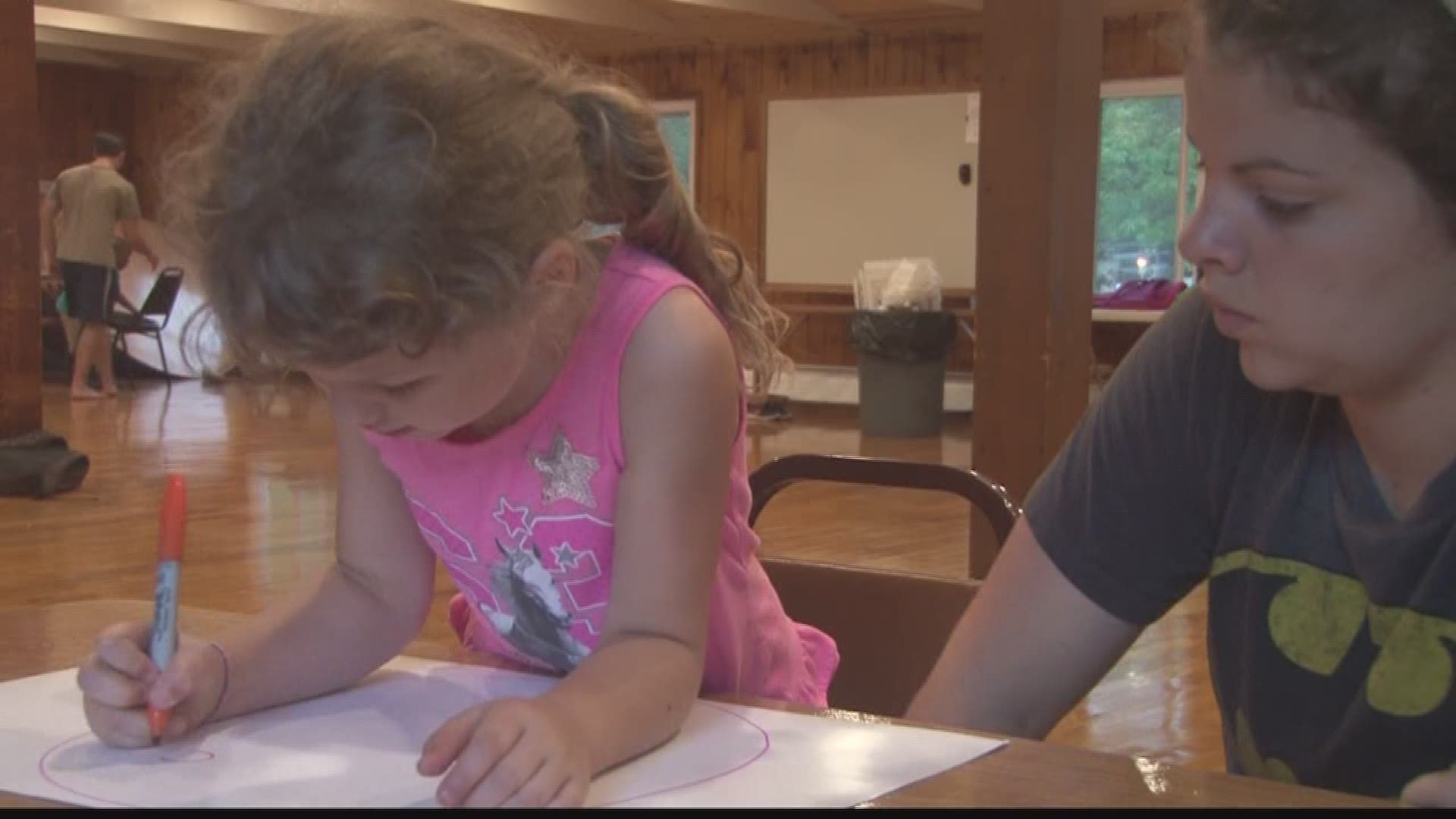 Kids from military families help each other through difficult times at Operation Purple Camp.
