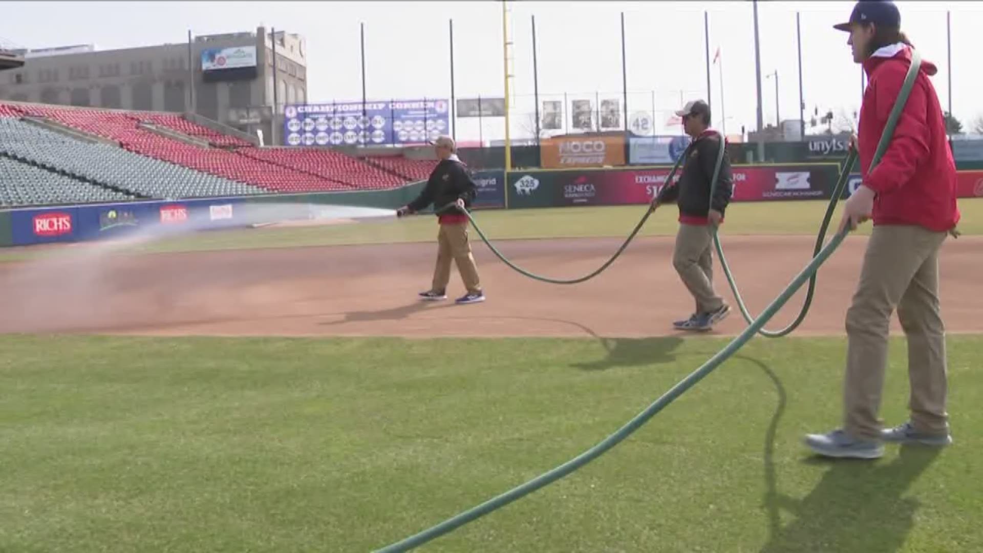ground crew spent the morning  getting the ball park ready for opening day.