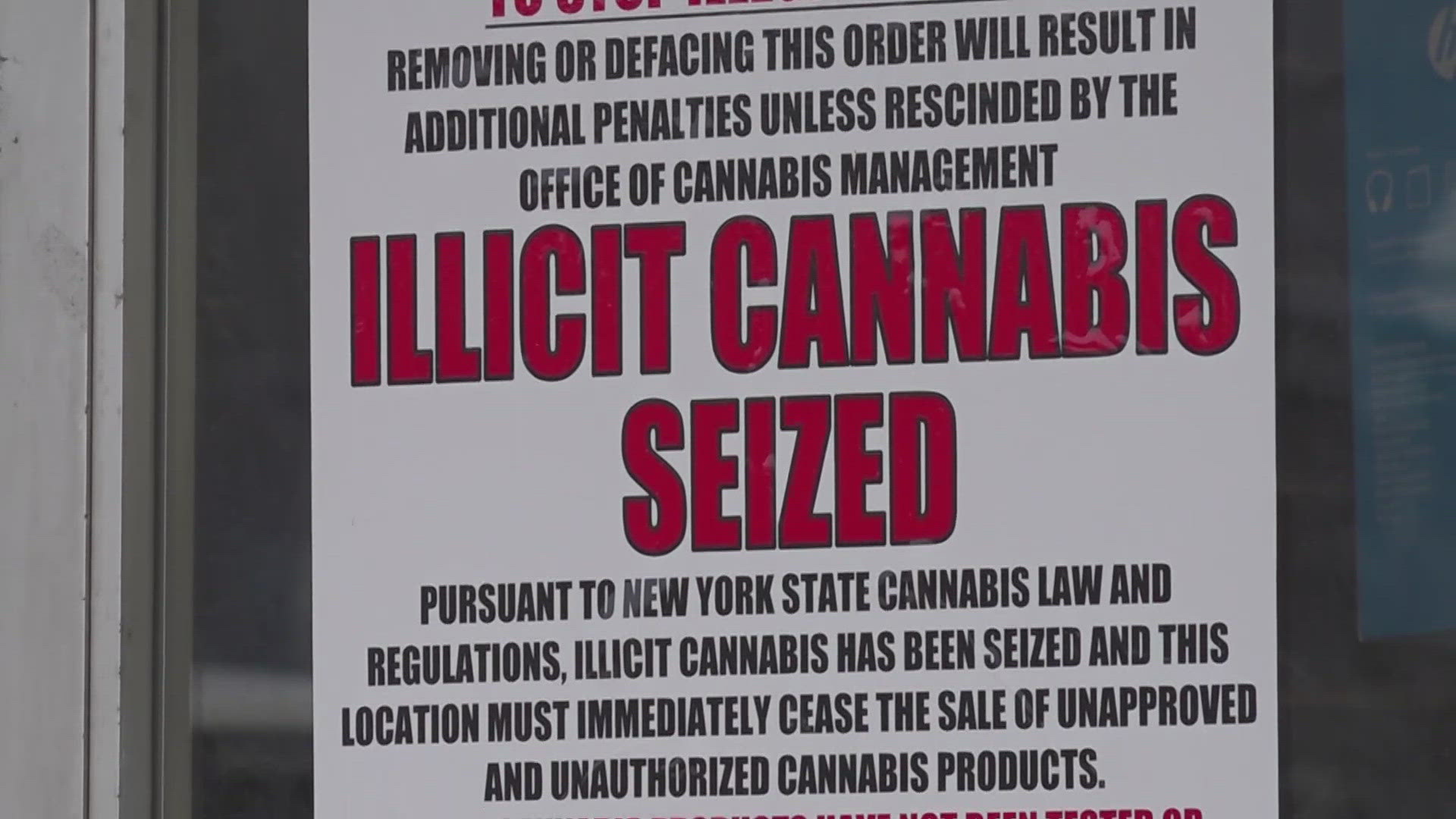 CANNABIS SHOPS, SHUTTERED OR MOMENTARILY HALTED BY THE STATE. THE WORDS "ILLICIT CANNABIS SEIZED" ON THEIR DOORS