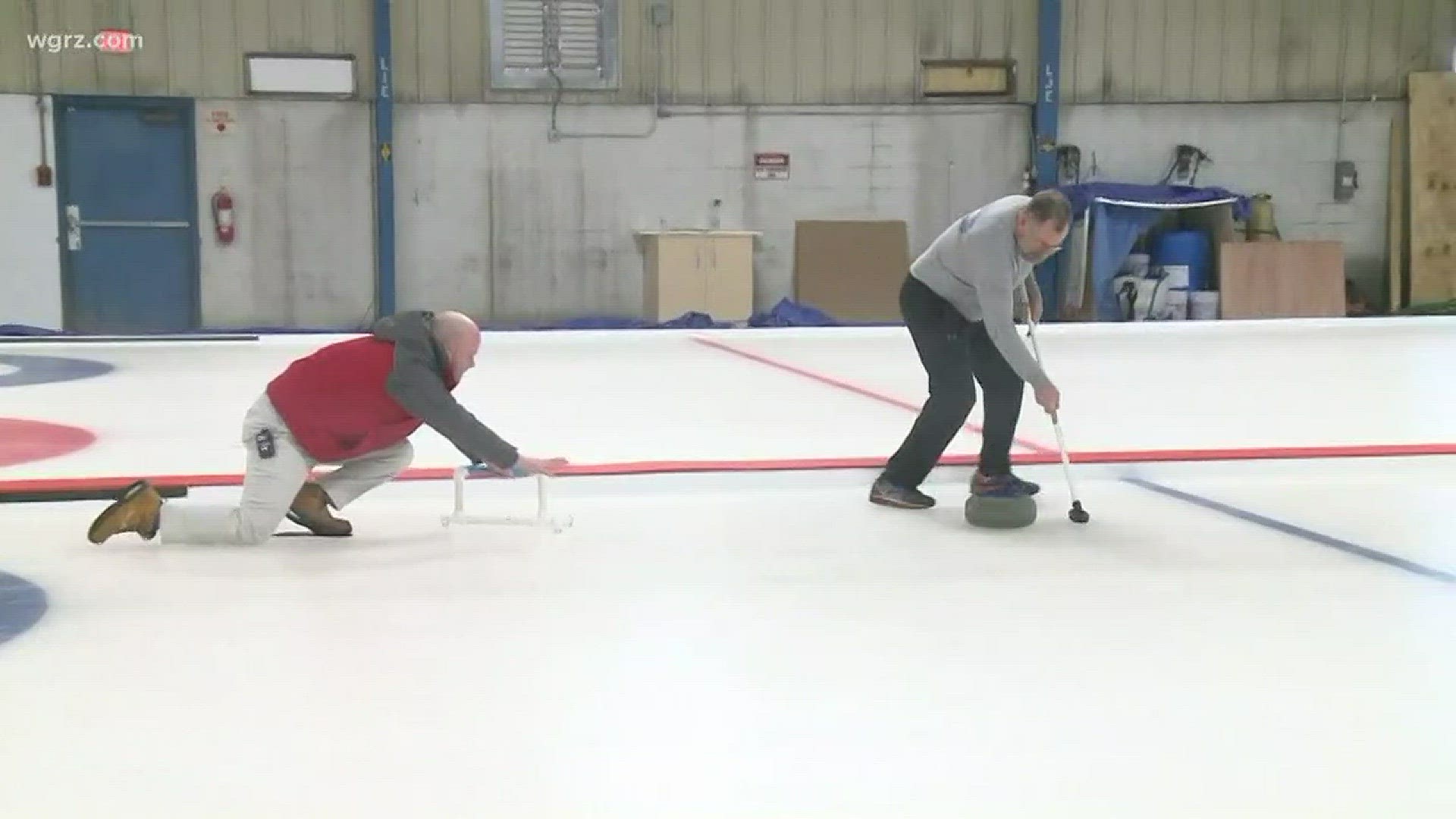 Daybreak's Joshua Robinson takes his first shot at curling as part of the Buffalo Curling Club's Open House, to kick off it's new indoor facility in South Buffalo