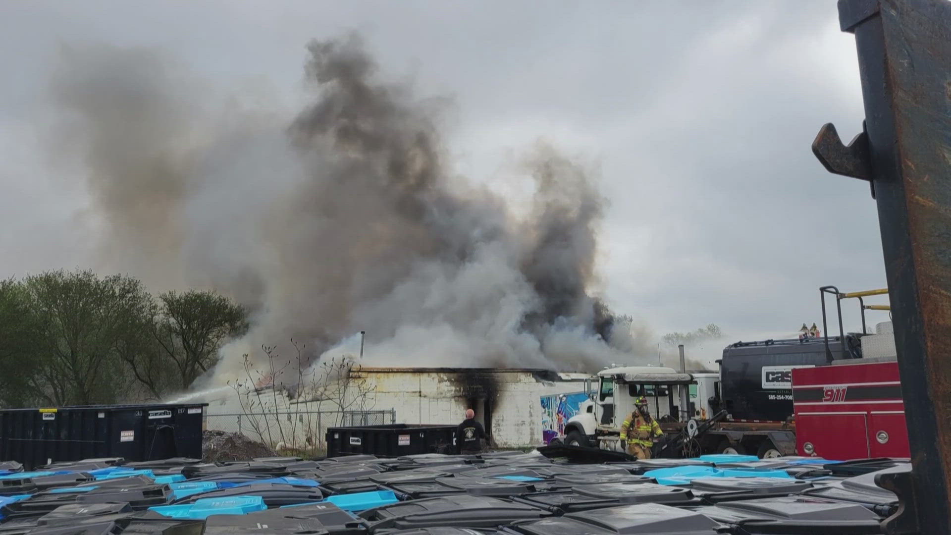 Fire crews from four counties battle a blaze in Genesee County, evacuating key buildings after 30 people safely escape.