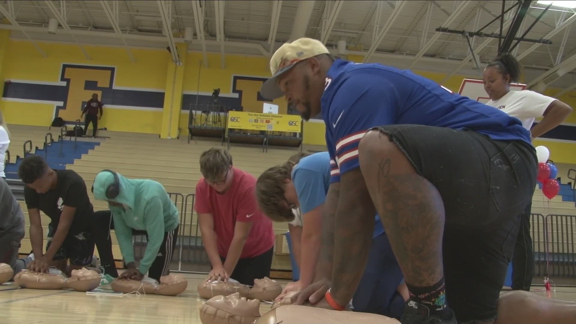 STUDENTS, PARENTS, AND COMMUNITY MEMBERS WERE OFFERED HANDS-ONLY C-P-R TRAINING AT NIAGARA FALLS HIGH SCHOOL.BILL'S OFFENSIVE TACKLE, DION DAWKINS, WAS THERE.