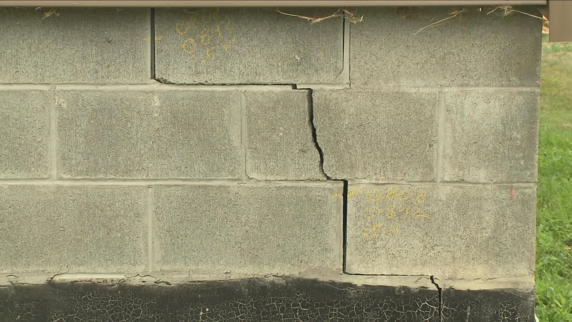 cracks in the ground, cracks in the actual road surface, and perhaps most concerning cracks in the foundation of the ten year old home of Gene Nati...