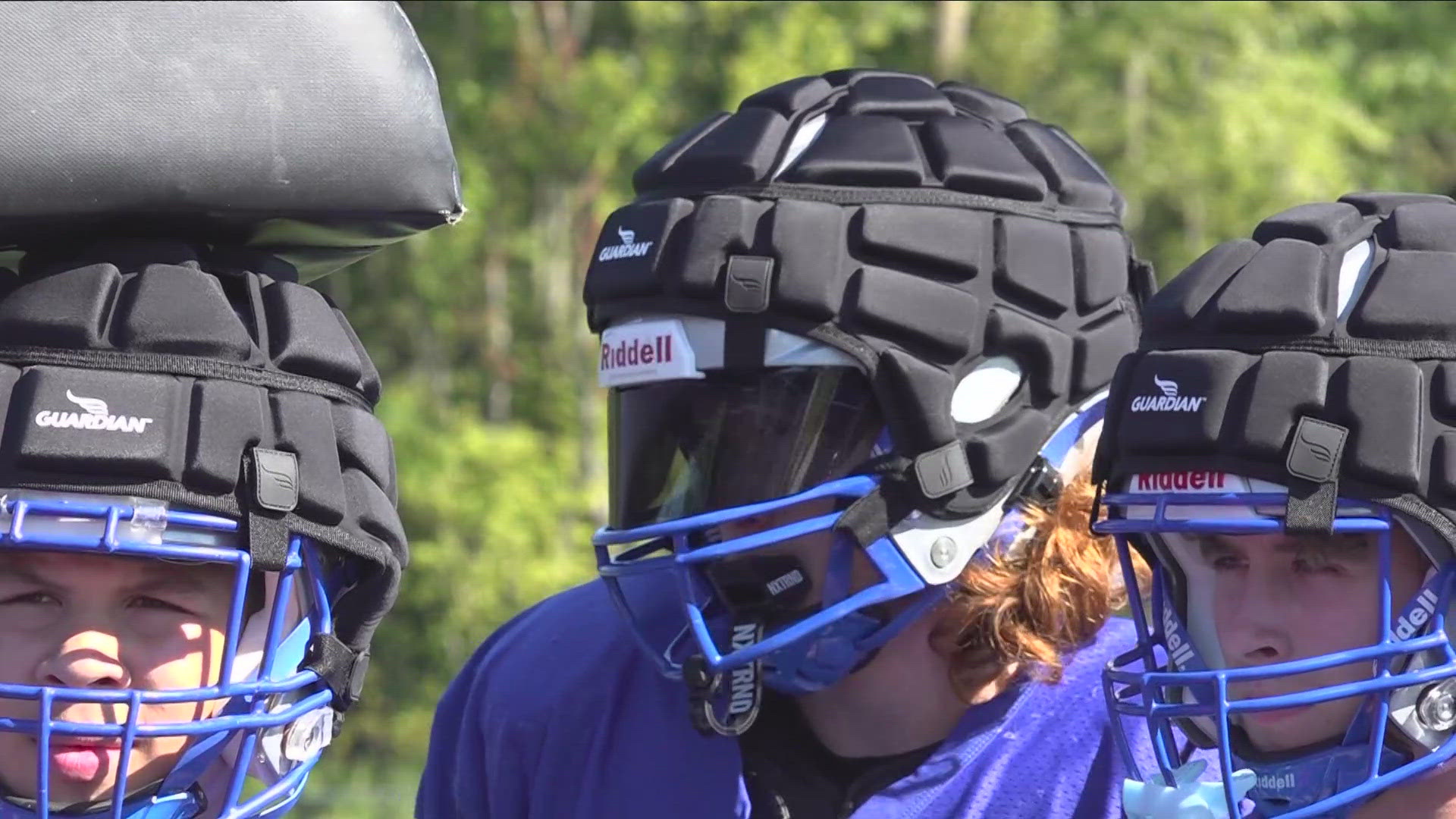 Guardian caps, a soft-shell helmet cover engineered to reduce the impact of player collisions in football.