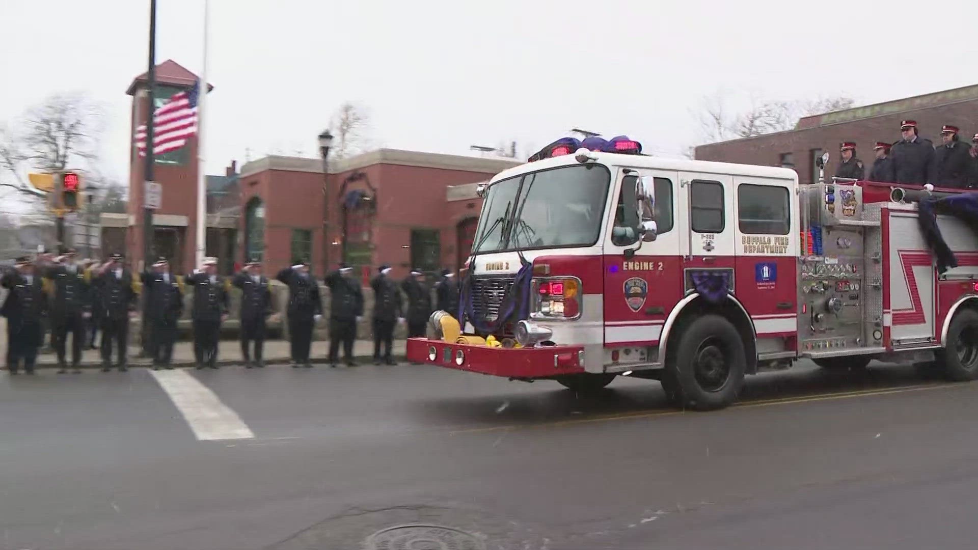 Buffalo firefighter Jason Arno funeral procession moves past his firehouse and then on to St. Joseph Church in downtown Buffalo.