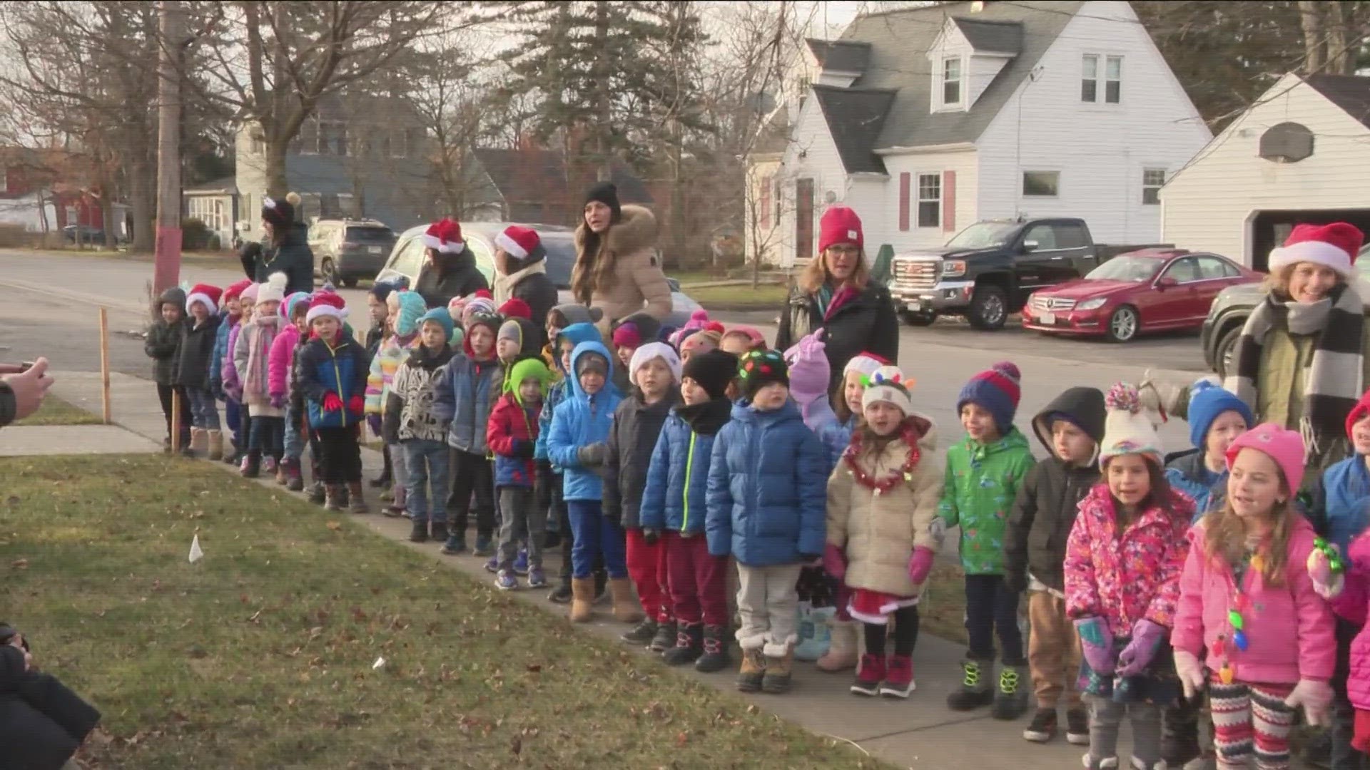 The kids made their way around the town, singing to community members and inside businesses.