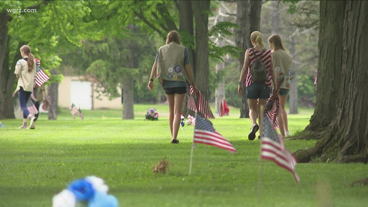 Scouts help place 4,500 flags at cemetery