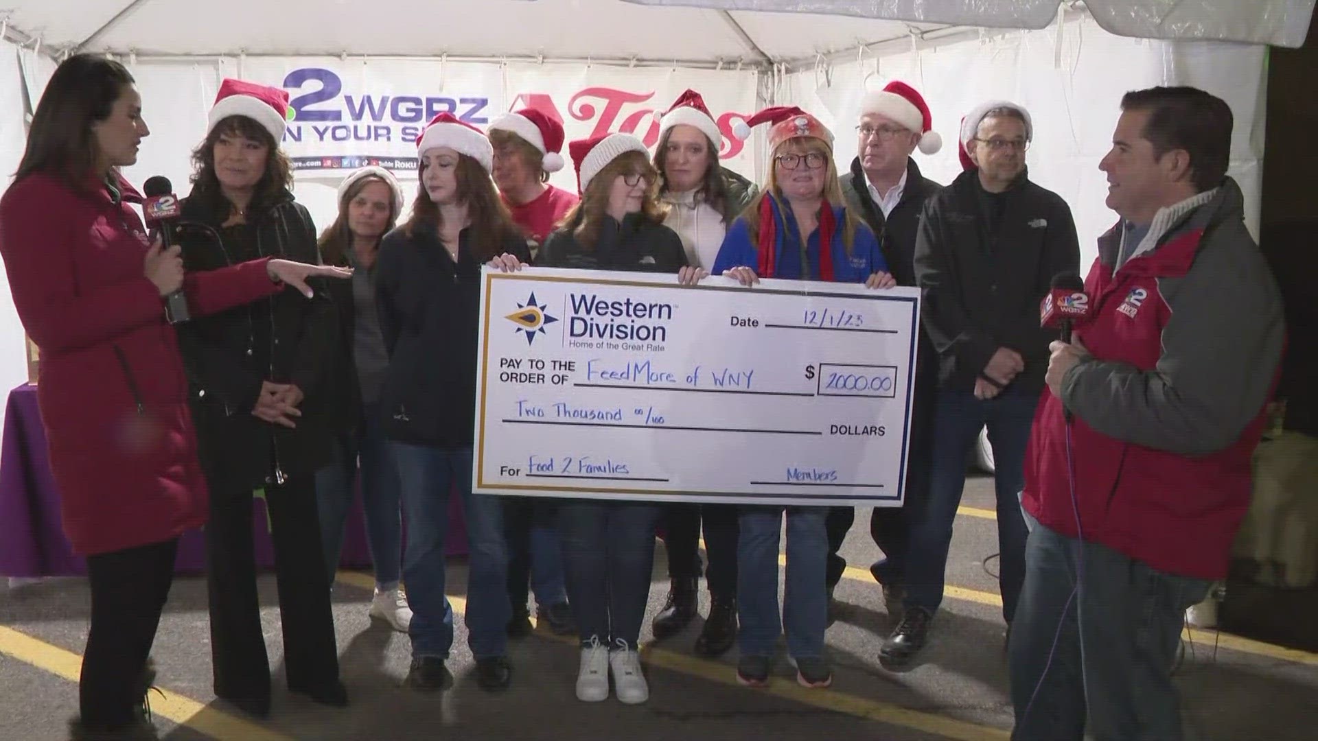 Western Division signs a big difference with a big check to FeedMore WNY.