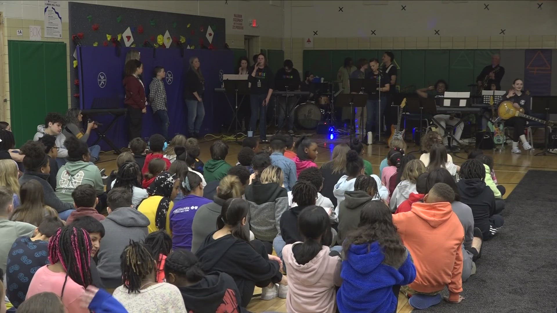 Elmwood Village Charter School students celebrating music at their first ever "Battle of the Bands" Thursday