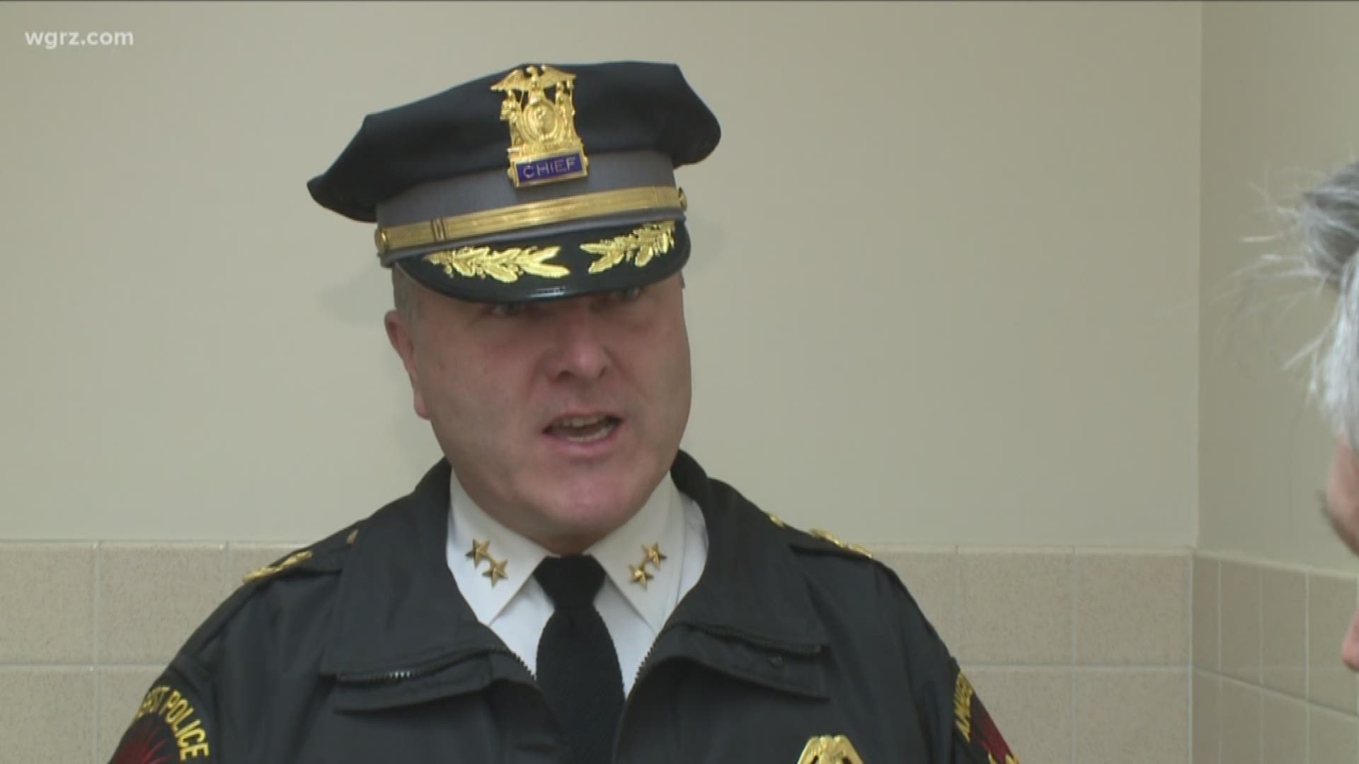 WHO HELPED A SUSPENDED COP SNEAK INTO AMHERST TOWN COURT YESTERDAY? THE AMHERST POLICE CHIEF IS DETERMINED TO FIND OUT.