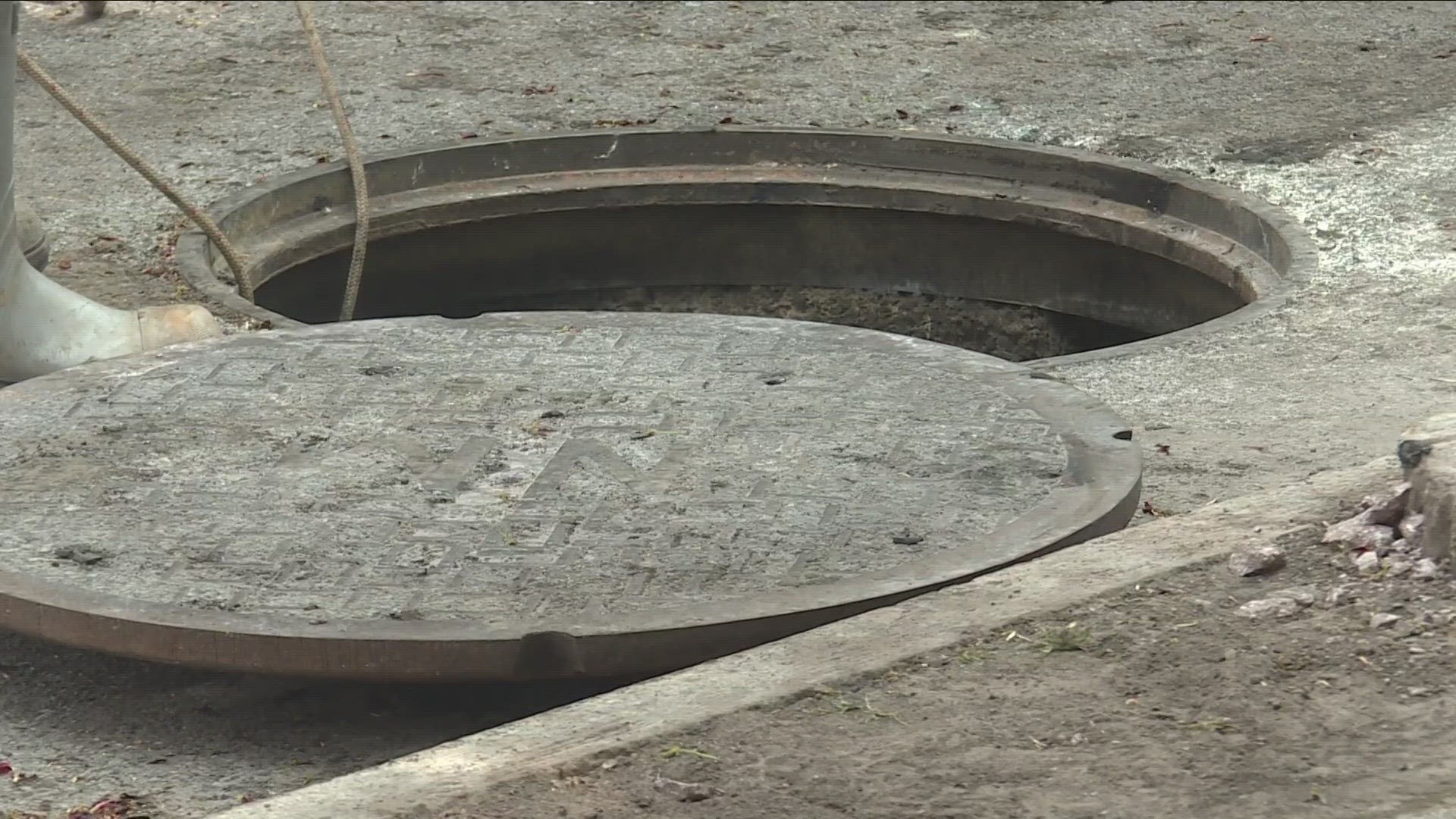 What caused the manhole explosions on Main Street over the weekend