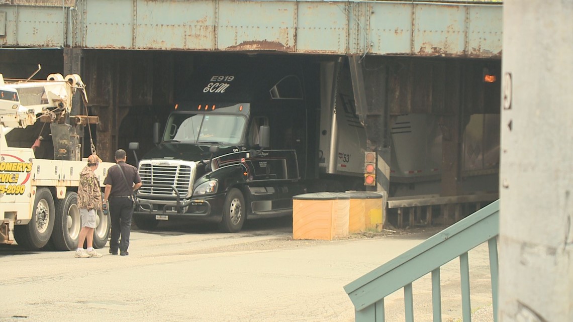 PHOTOS: Tractor Trailer gets stuck under Clinton Street bridge | wgrz.com