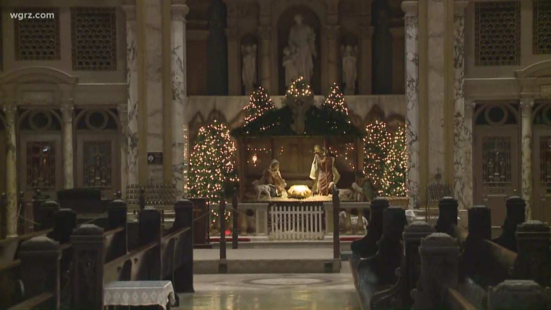 Decorations feature nativity scene and hundreds of poinsettias