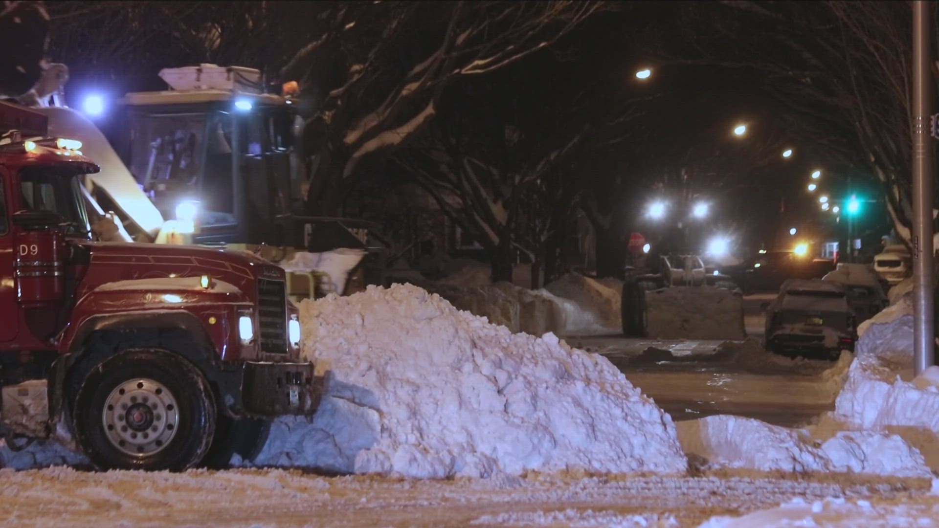 Heavy equipment is being used to scoop and remove snow from clogged streets where up to 4 feet of snow fell in the most recent lake effect storm.