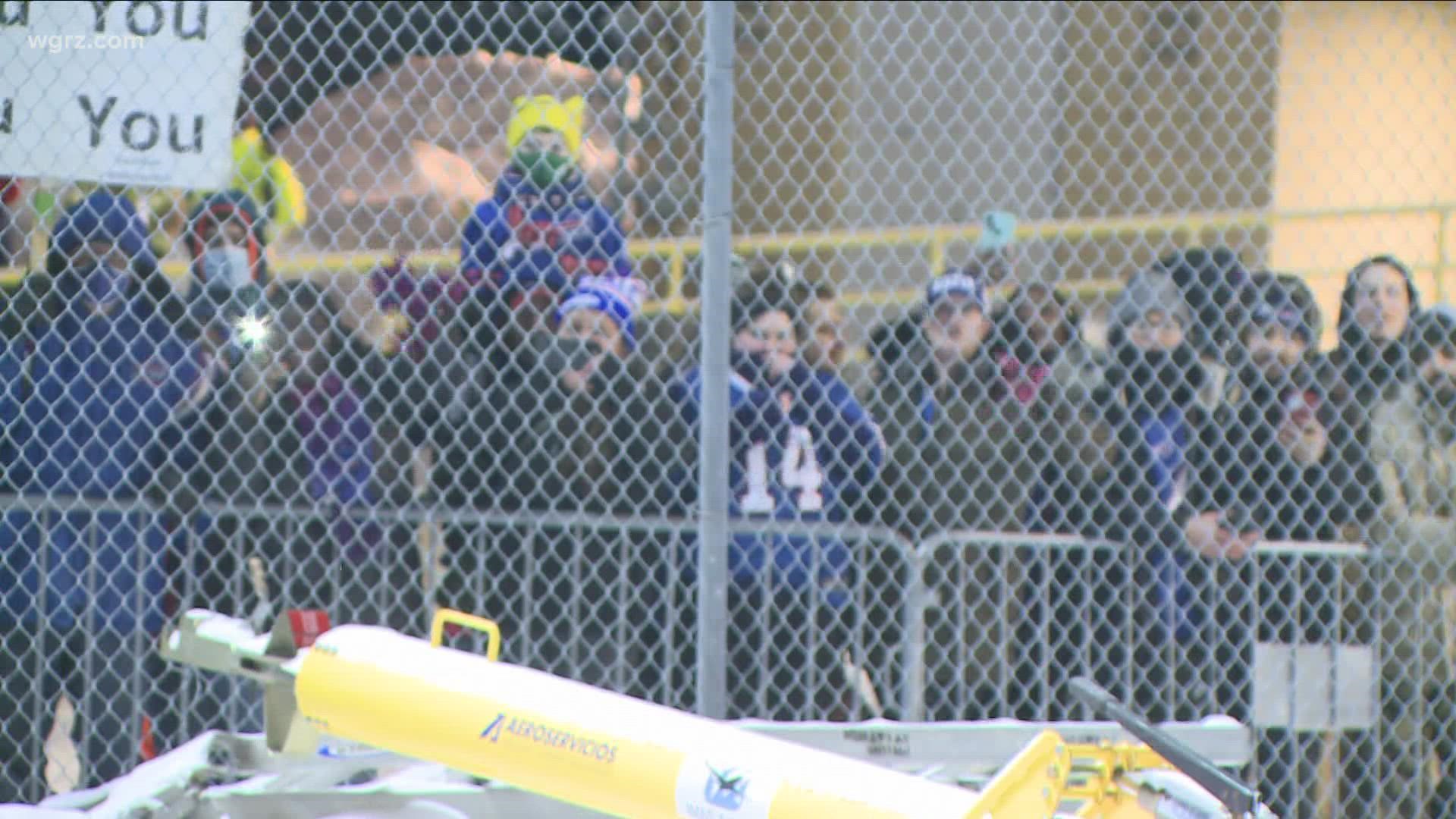 Bills fans started arriving to the airport before midnight and waited in the cold until the team touched down close to 3 a.m.