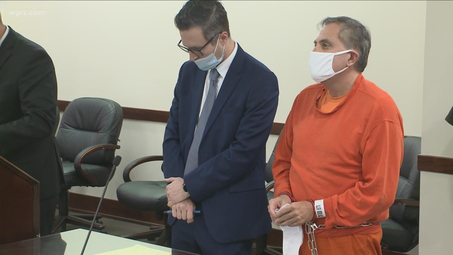 The former Erie County Democratic chair appeared in court in handcuffs and an orange jail jumpsuit.