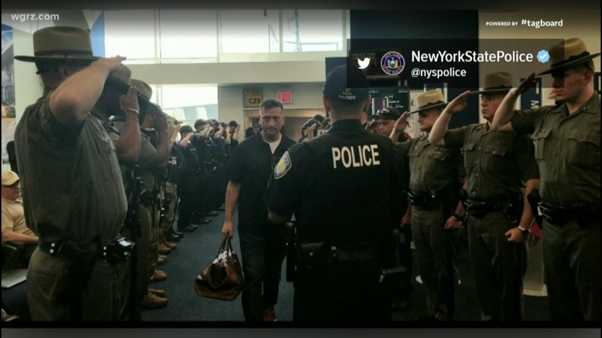 a line of troopers who were there to greet Staff Sergeant Bellavia at Laguardia Airport today.
