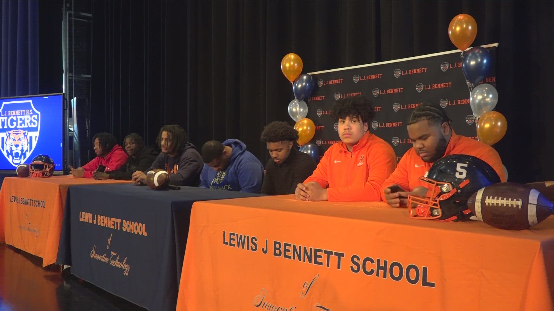 A record-setting seven seniors signed to play college football.