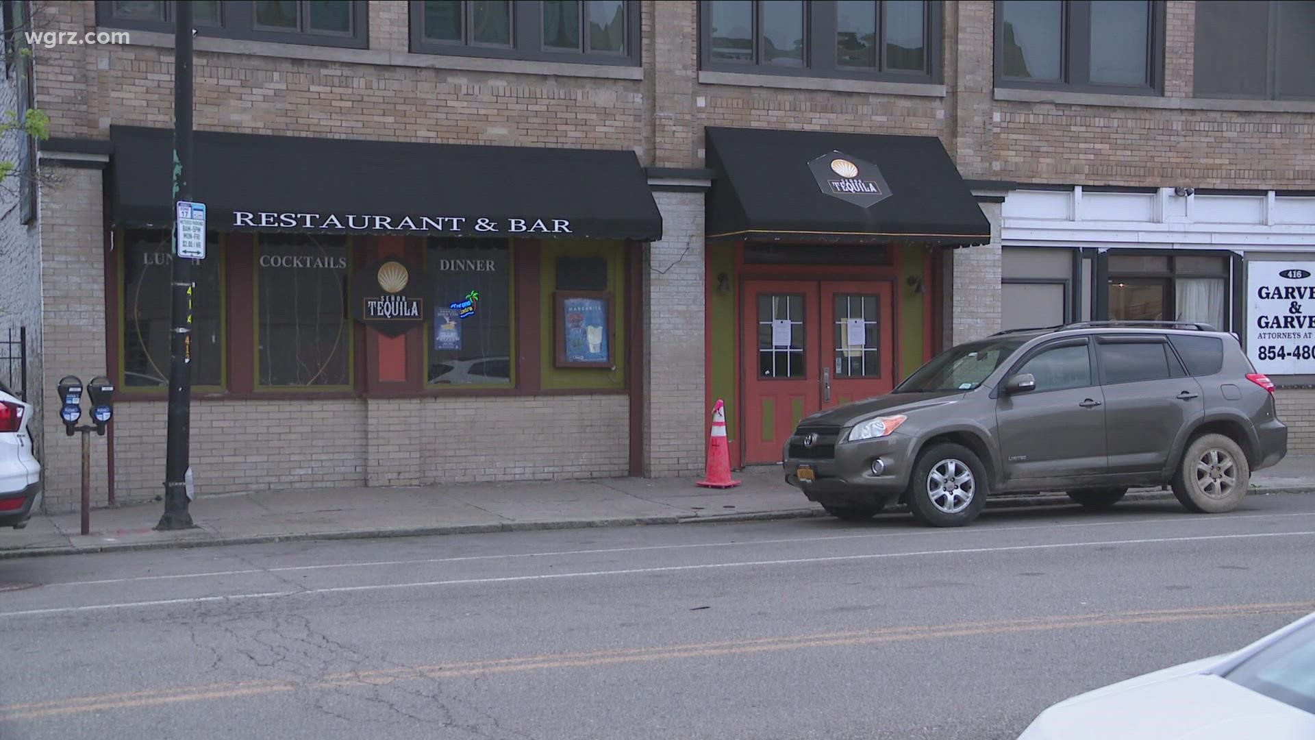 The Erie County DA's office says three people are facing charges after a shooting that hurt two people outside a business on Pearl Street over the weekend.