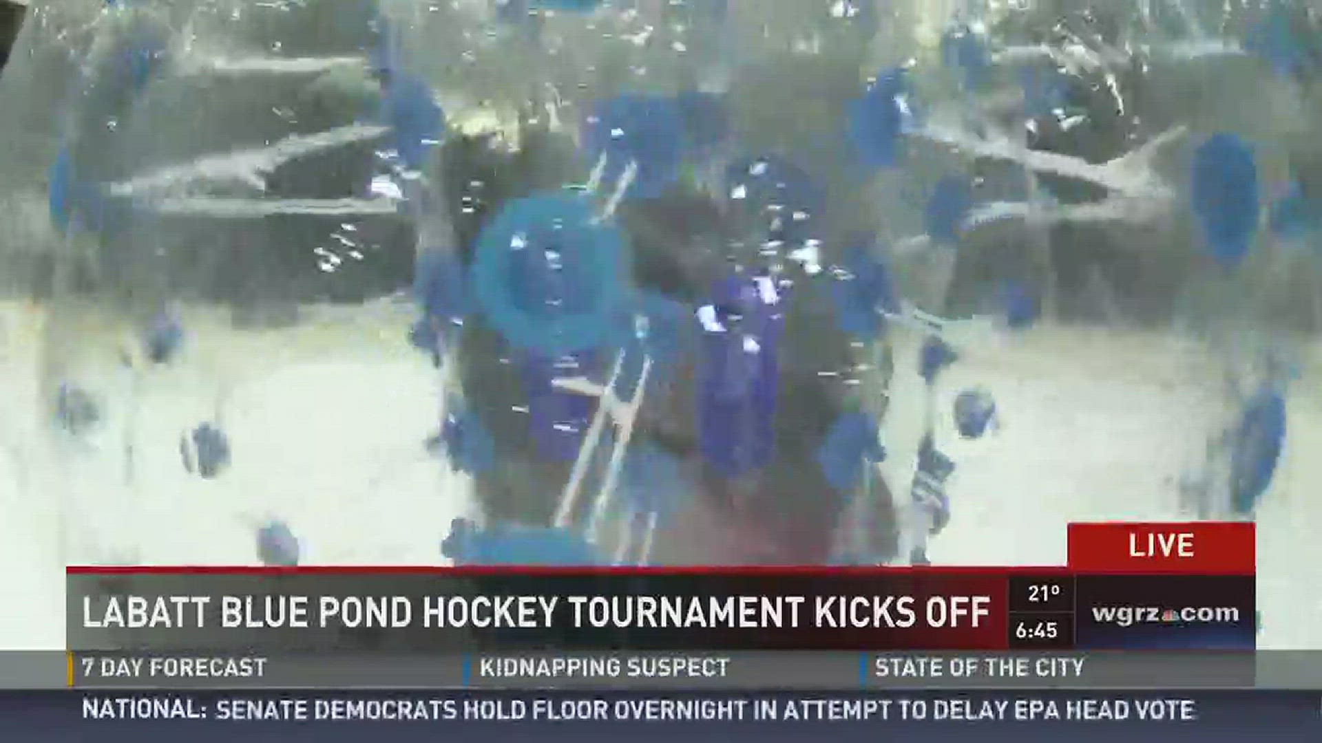 Daybreak's Pete Gallivan has some fun with the bubble hockey live from the 10th Labatt Bolue Pond Hockey Tournament.