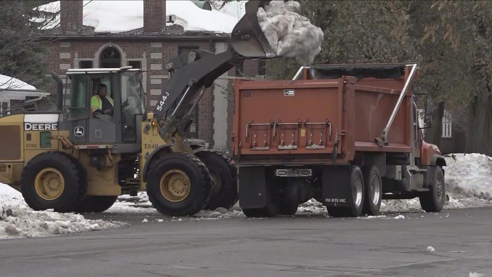 Crews are split doing one of two things removing snow or clearing streets