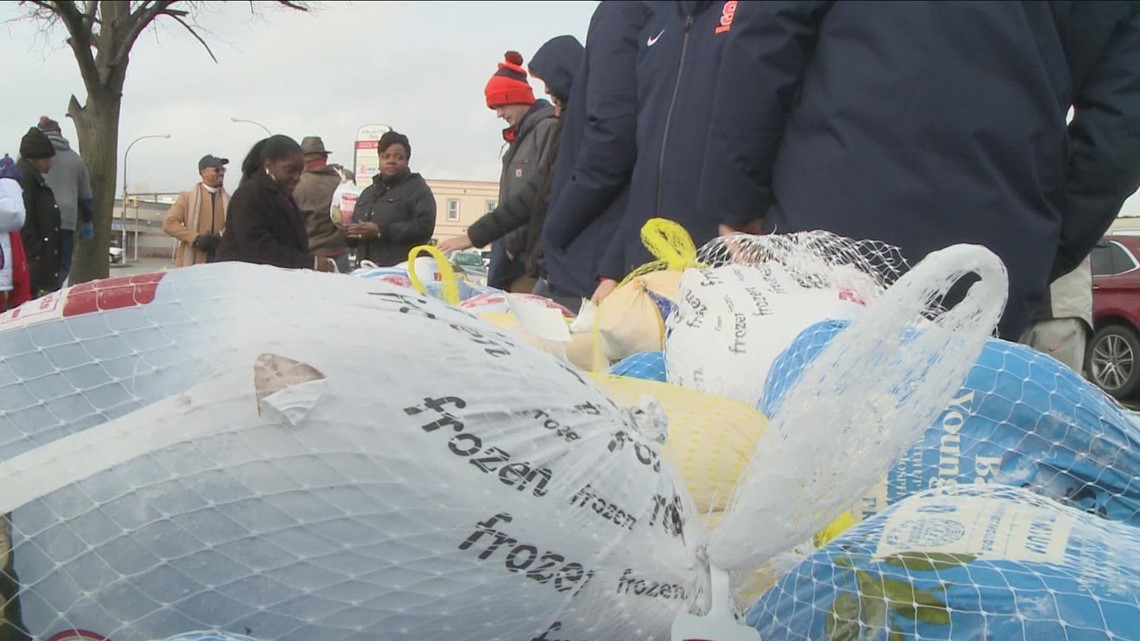 Giving more than a turkey: Syracuse student-athletes host turkey giveaway at Tops on Jefferson Avenue