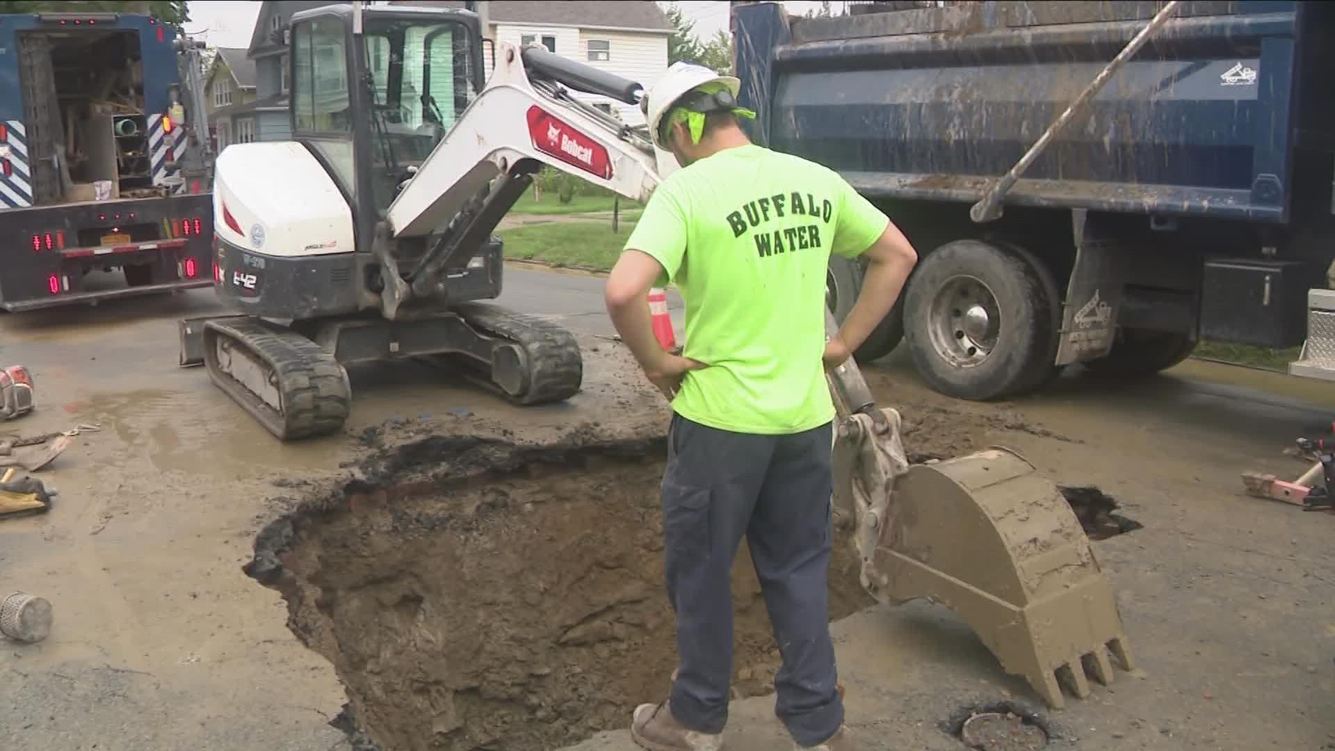 a water main break likely led to this sinkhole opening up in South Buffalo.