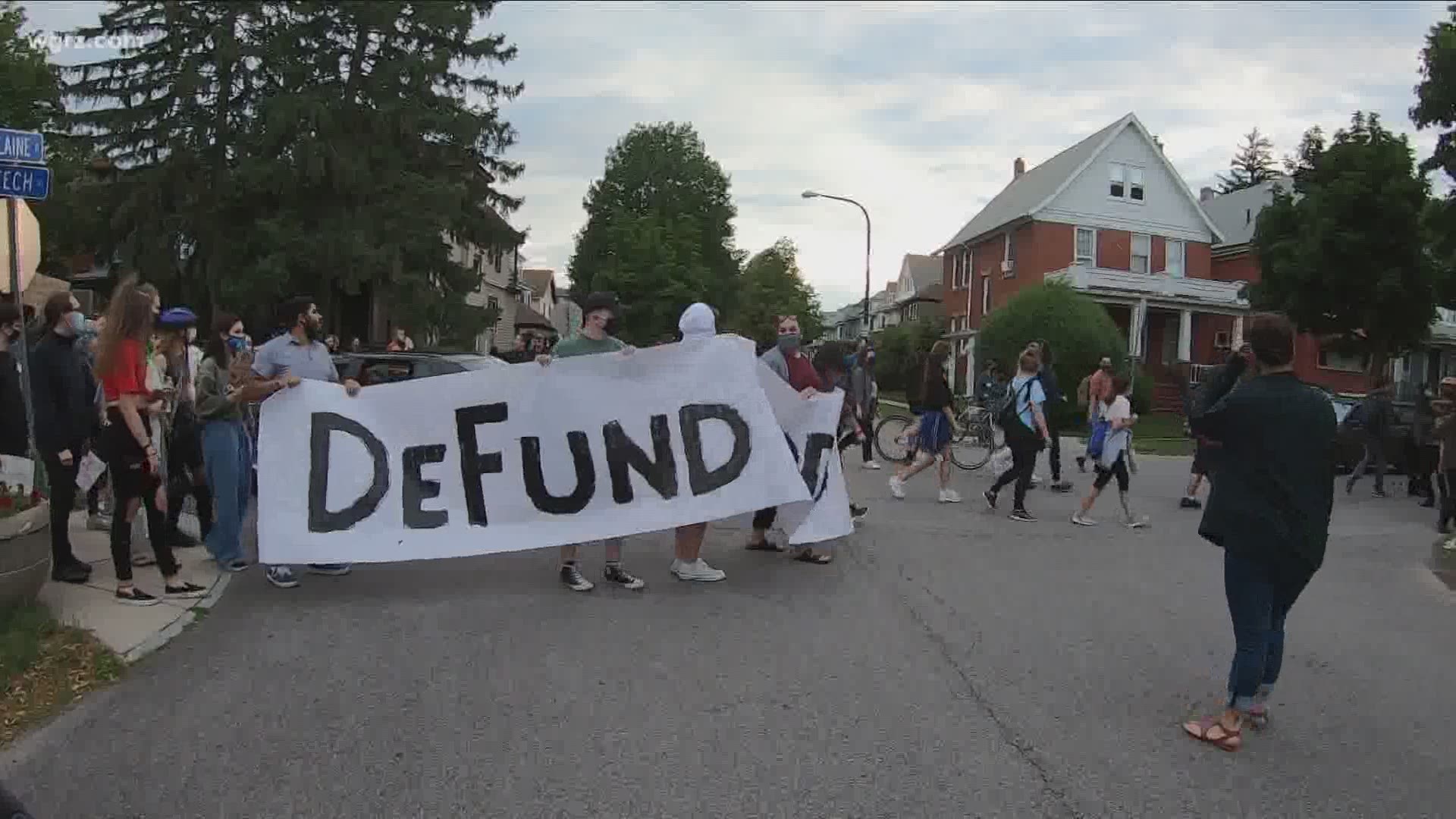 A group of protesters marching through the city of Buffalo on Wednesday night reached Mayor Byron Brown's house when police escorted the mayor away from the scene.