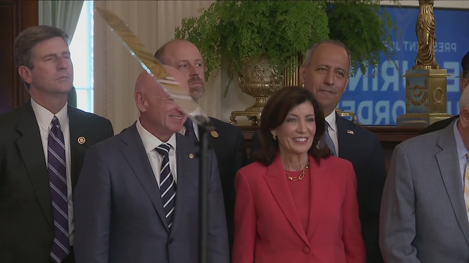 Governor Hochul seen here in a bright red dress amongst Democratic Senators and other leaders was present this afternoon at the White House