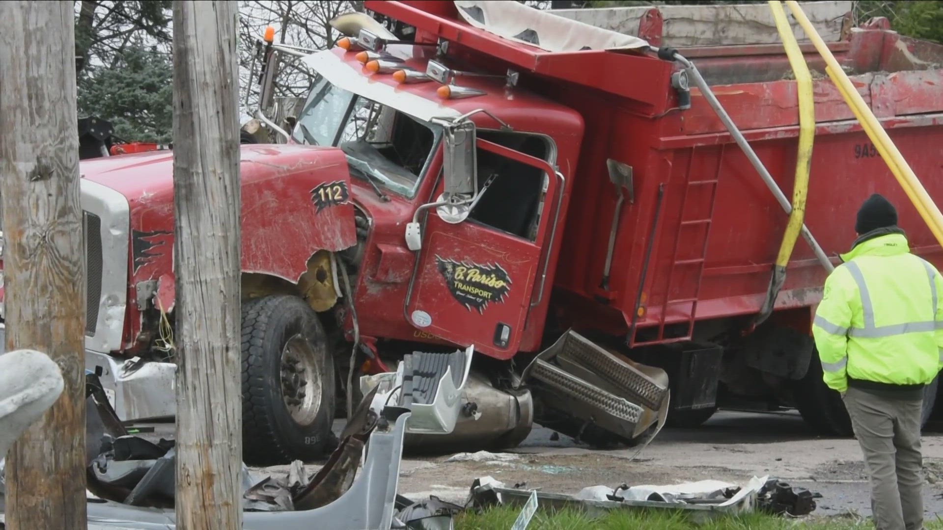 The dump truck driver was extricated, then taken to a hospital to be treated for injuries.