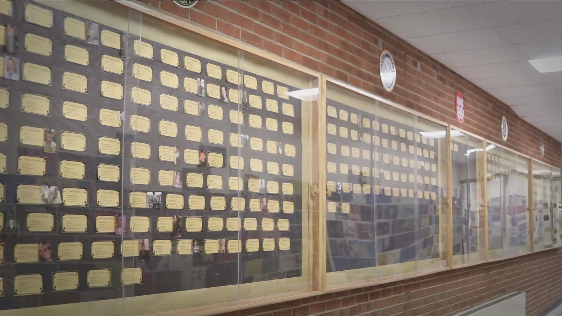 Three students dedicated over 100 hours outside of school to create a wall honoring veterans from Silver Creek.
