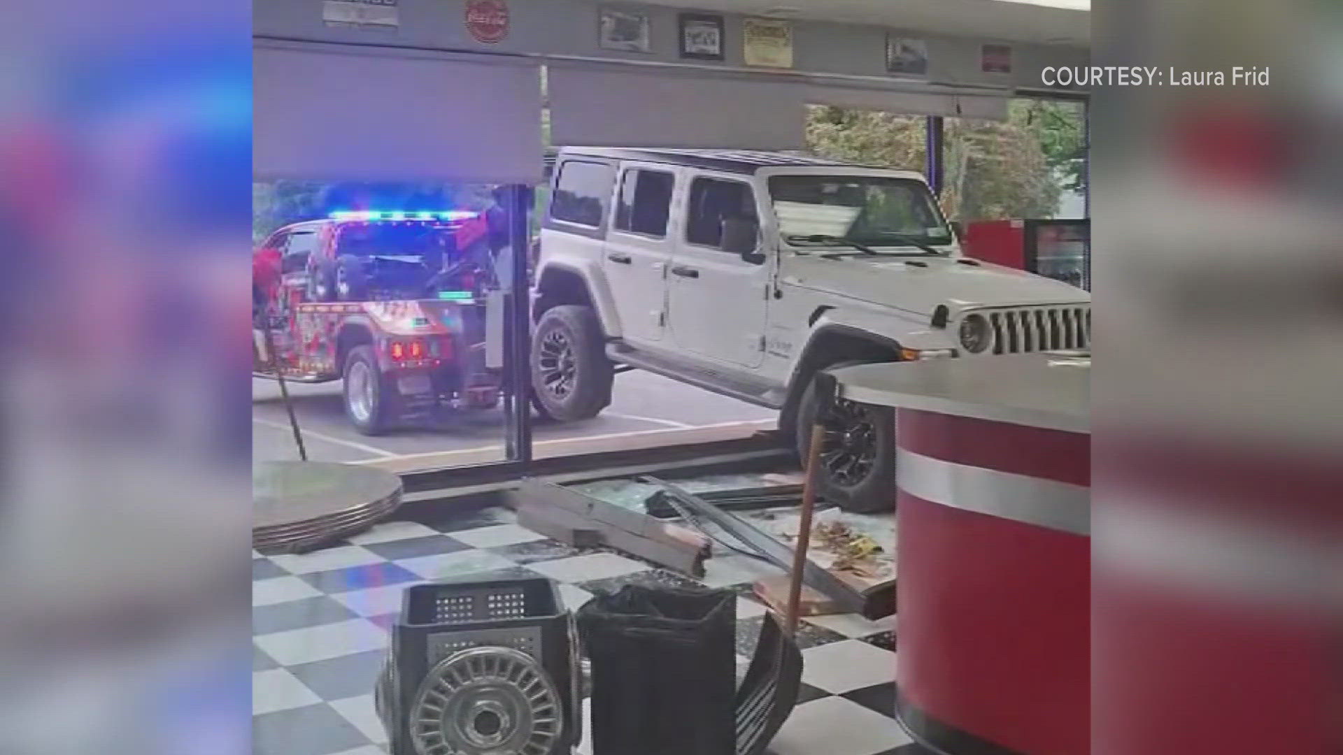 A 2018 Jeep Wrangler drove through Pizza Del Aureo's on Thursday in East Aurora. 