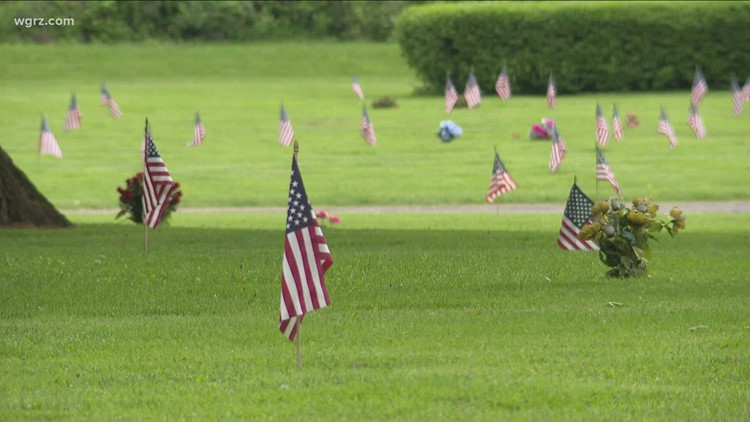 Scouts place flags for Memorial Day